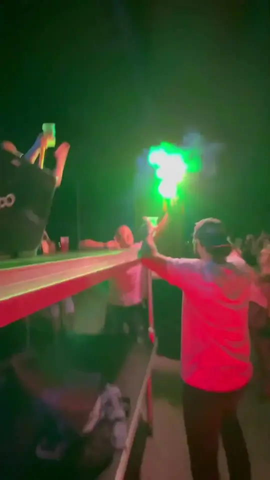 Play clip: a green flare going off above the crowd.