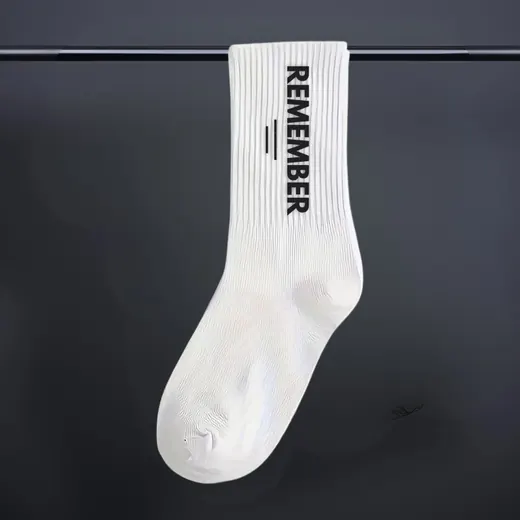 A sock with the word Remember printed down the side.